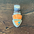 A Signed Orange Spiny Oyster Opal Sterling Triangular Inlay Pendant