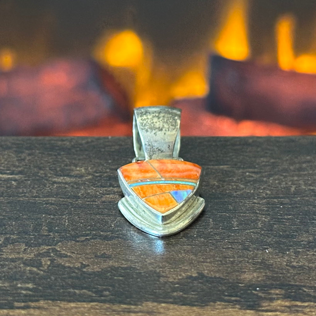 A Signed Orange Spiny Oyster Opal Sterling Triangular Inlay Pendant