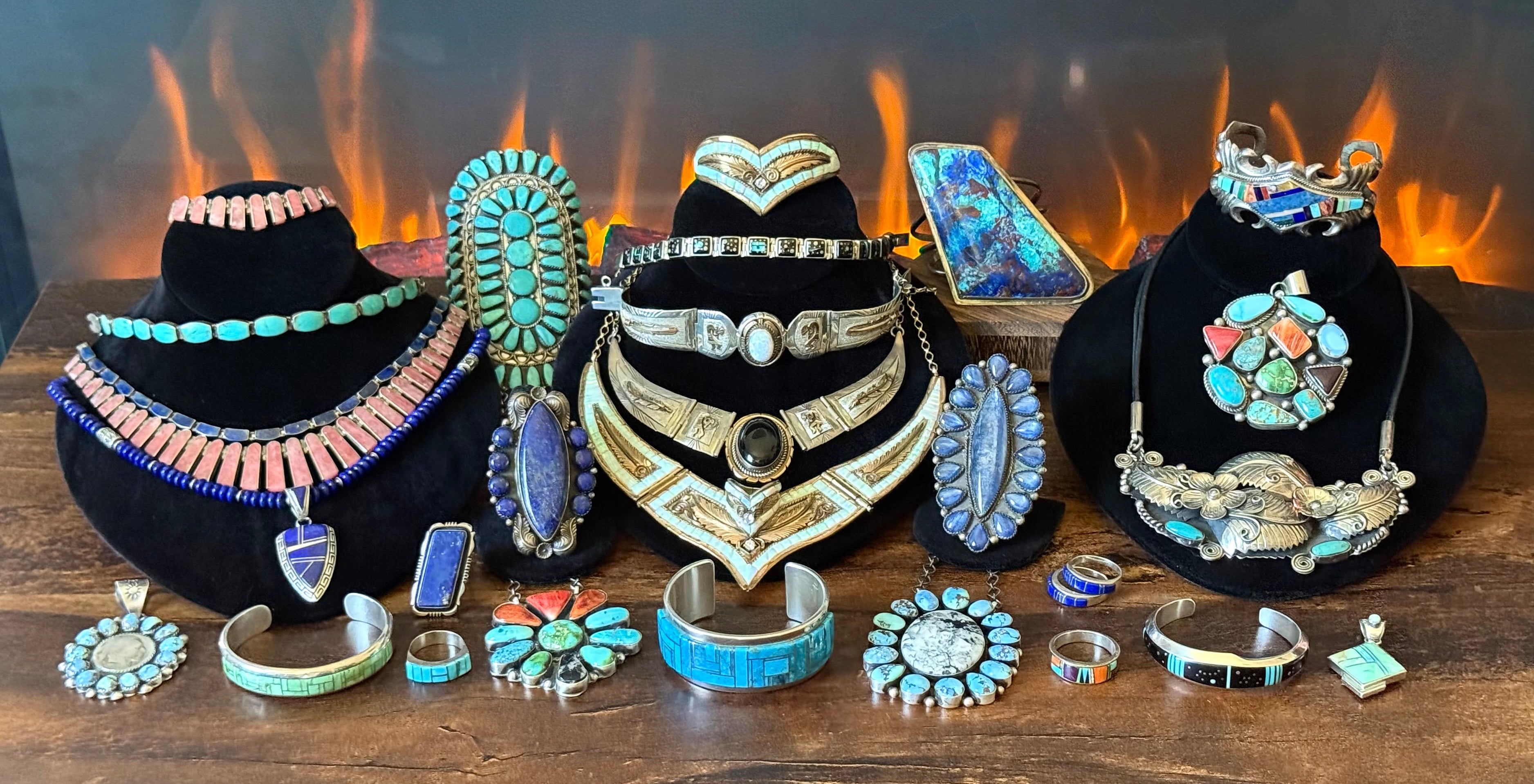 Collection of jewelry on display with a fiery background